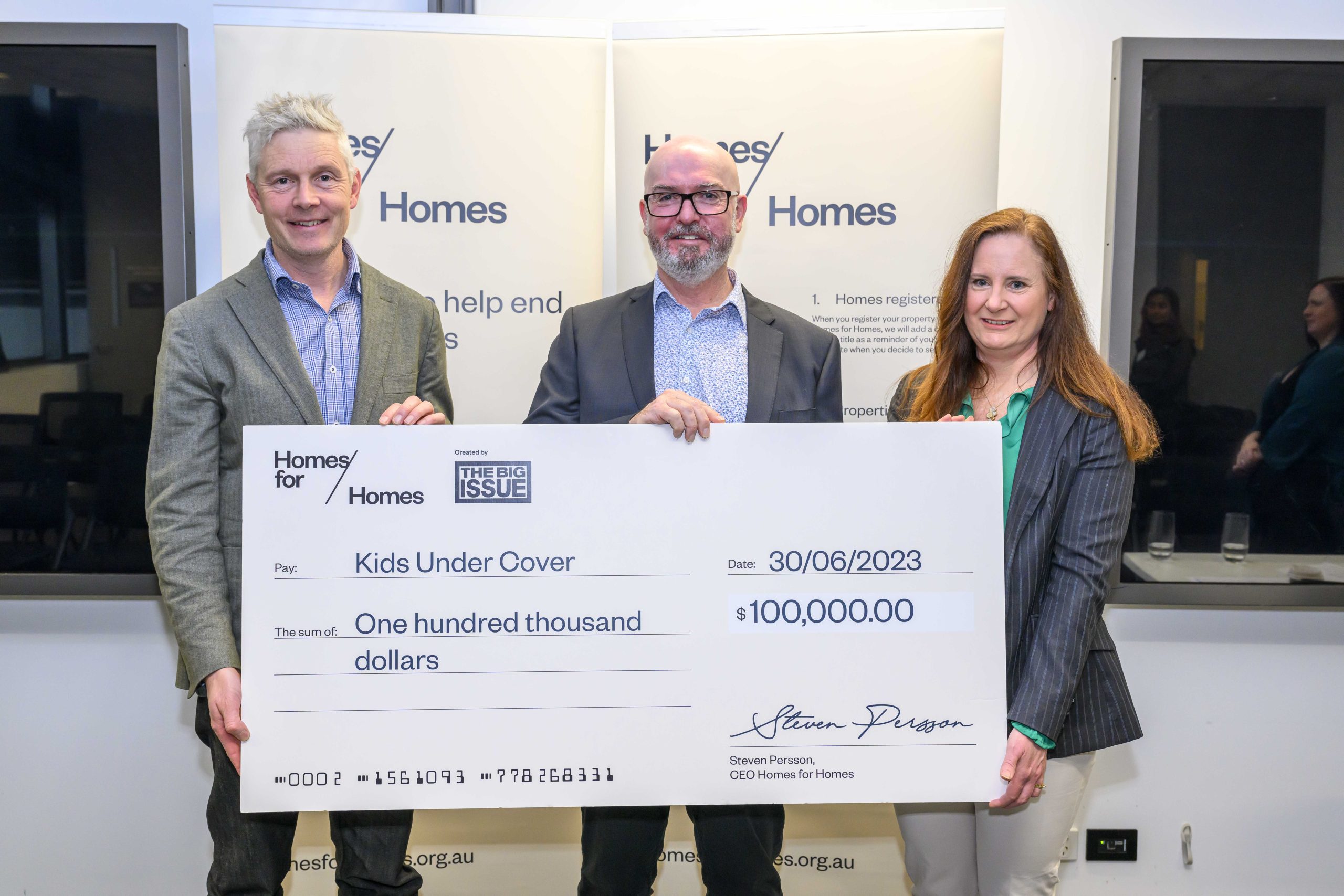 Jason Shaw from Balcon presents a cheque to Homes for Homes to support Kids Under Cover